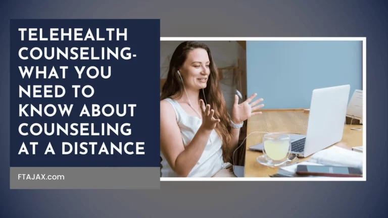 A person engaged in a telehealth counseling session, wearing headphones, gesturing while sitting at a table with a laptop
