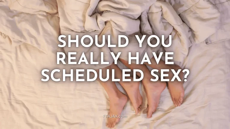 A couple lying in a bed with fabric covering them