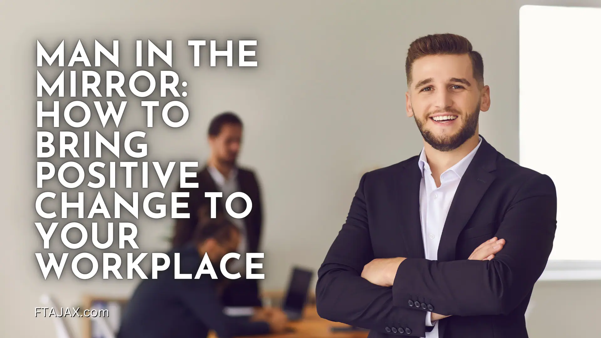 A confident man in a suit stands with arms crossed, set against a modern office backdrop, conveying leadership and positivity in the workplace